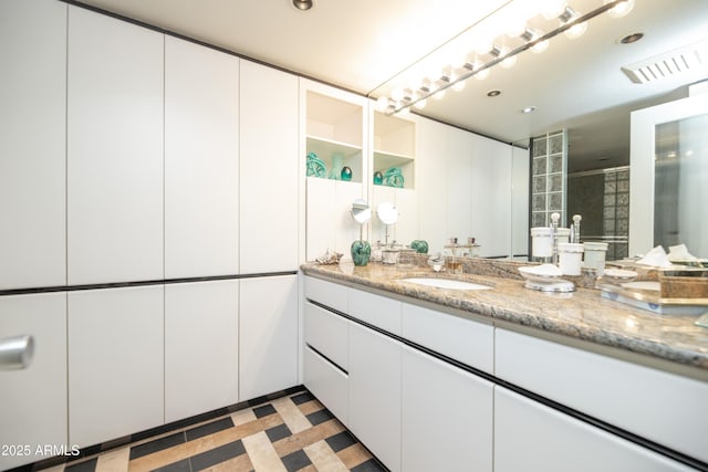 bathroom with vanity, tile patterned floors, and recessed lighting