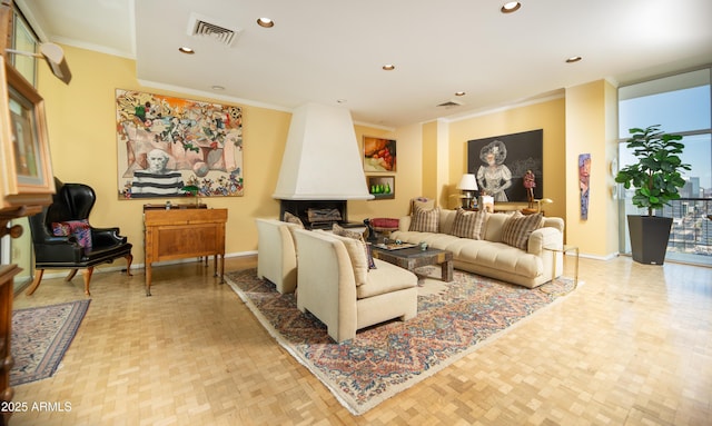 living room featuring recessed lighting, visible vents, baseboards, and ornamental molding