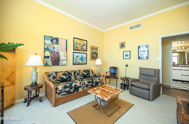 living area featuring visible vents, baseboards, and crown molding