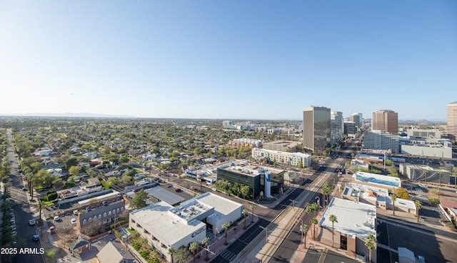 birds eye view of property with a view of city