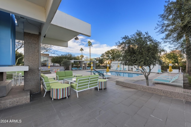 view of patio / terrace with a fenced in pool