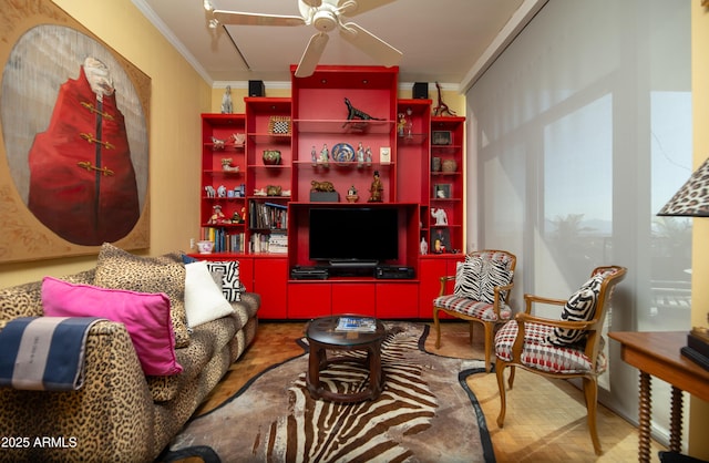 living area featuring ceiling fan and ornamental molding