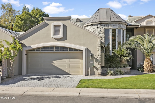 view of front of property with a garage