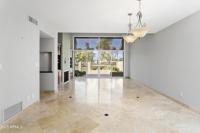 unfurnished dining area featuring a fireplace