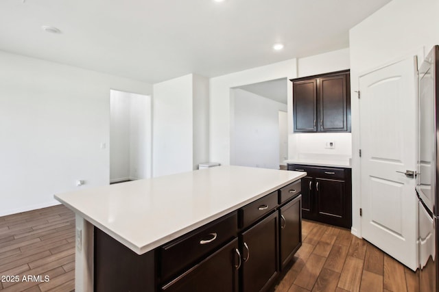 kitchen with dark brown cabinets and a kitchen island