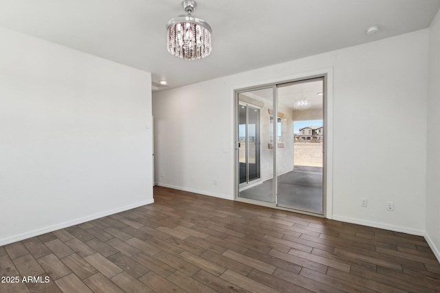 empty room featuring a chandelier