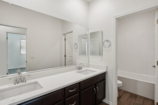 full bathroom featuring shower / tub combination, vanity, and toilet