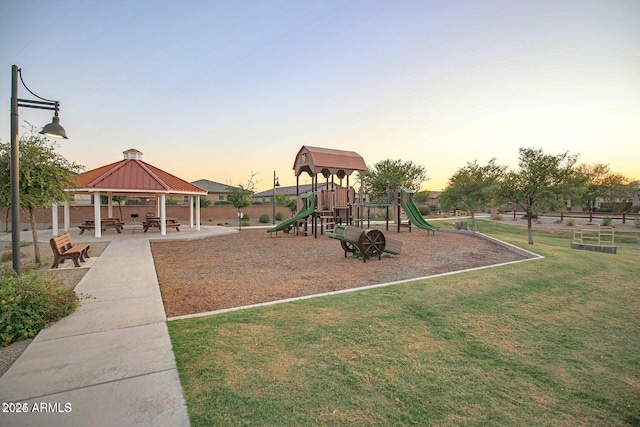 playground at dusk with a yard and a gazebo