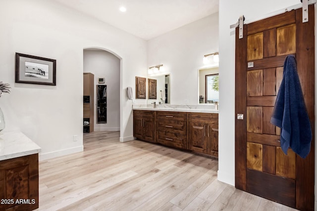 bathroom with vanity and wood-type flooring