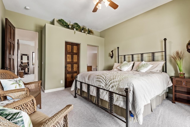 bedroom with ceiling fan and light colored carpet