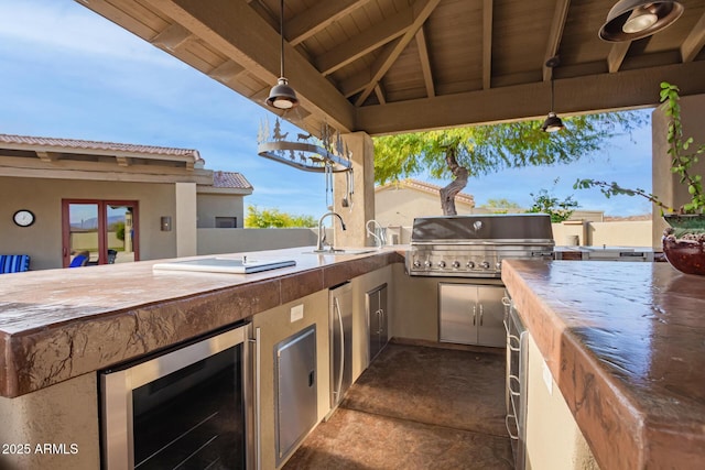 view of patio / terrace with sink, beverage cooler, grilling area, a gazebo, and area for grilling