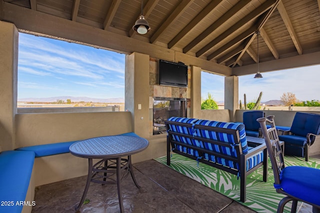 exterior space featuring an outdoor living space with a fireplace