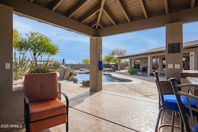 view of patio / terrace featuring a gazebo and a fenced in pool