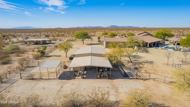 birds eye view of property with a mountain view