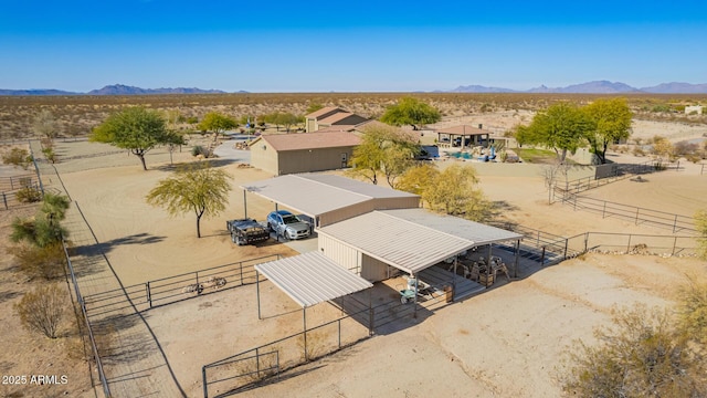 birds eye view of property featuring a mountain view