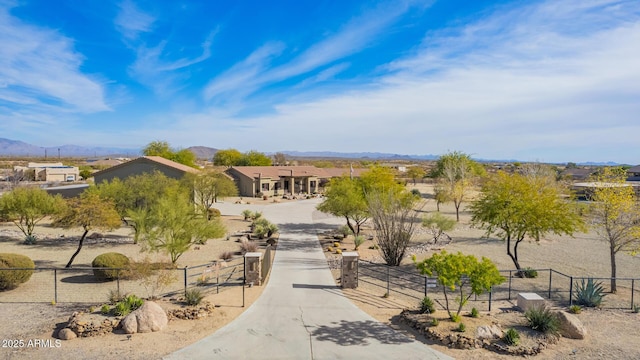 surrounding community with a mountain view