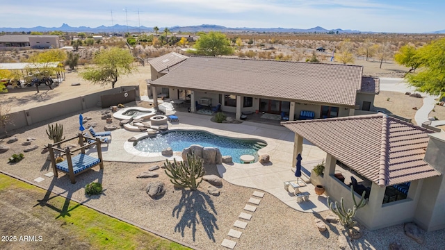 view of pool featuring a mountain view and a patio area