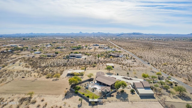 birds eye view of property featuring a mountain view