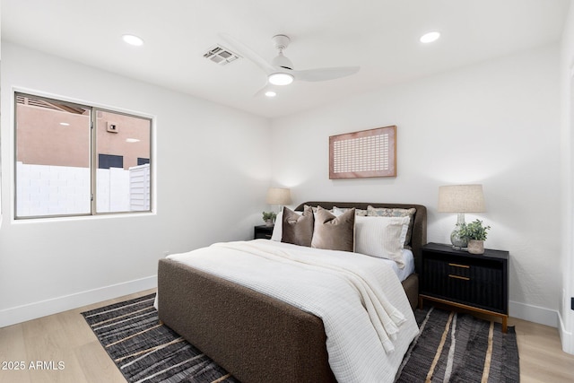 bedroom with recessed lighting, baseboards, visible vents, and light wood-type flooring