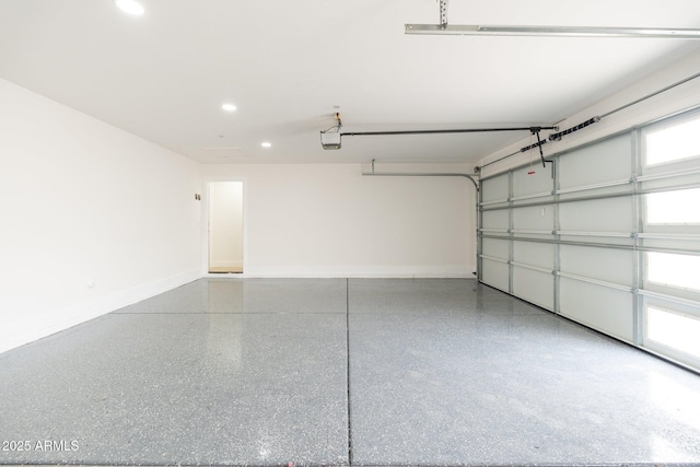 garage with recessed lighting, a garage door opener, and baseboards