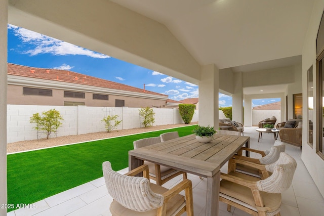 view of patio / terrace featuring outdoor dining space and a fenced backyard