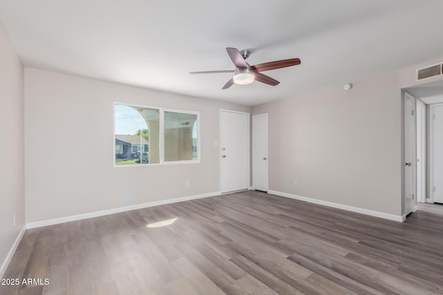 empty room featuring ceiling fan and wood-type flooring