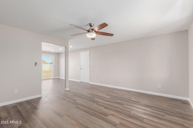 unfurnished room with ceiling fan and light wood-type flooring