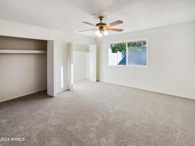 unfurnished bedroom featuring carpet floors and ceiling fan