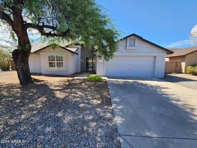 ranch-style house featuring a garage