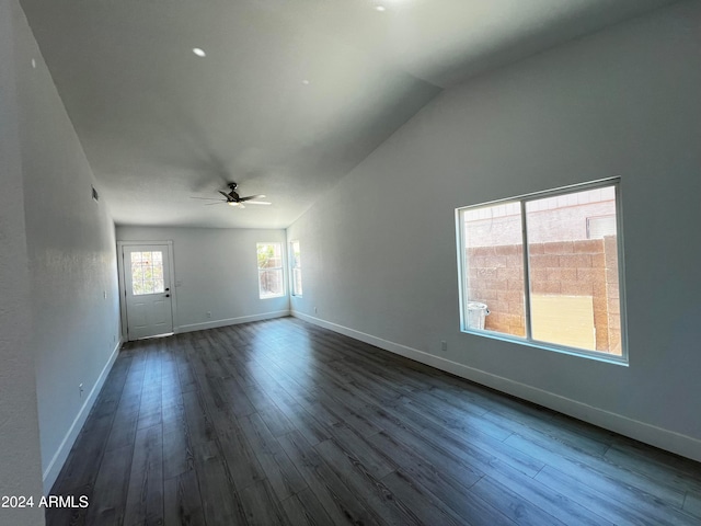 unfurnished room featuring ceiling fan, dark hardwood / wood-style floors, and lofted ceiling