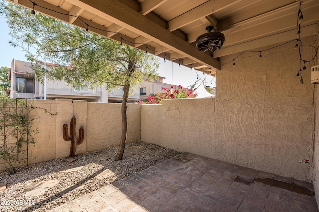 view of patio / terrace featuring fence