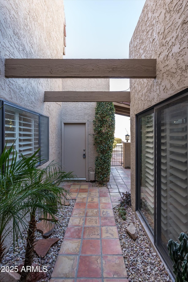 view of patio / terrace with a gate