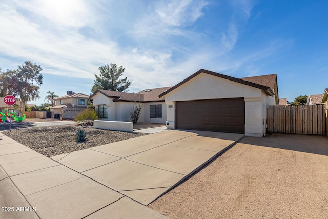 13918 N 78th Ave, Peoria, AZ 85381 - ranch-style home featuring concrete driveway, a garage, and stucco siding