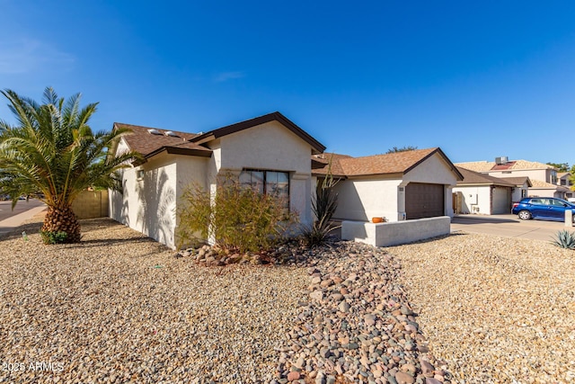 13918 N 78th Ave, Peoria, AZ 85381 - ranch-style house featuring concrete driveway, an attached garage, and stucco siding