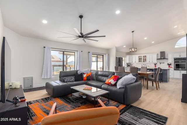 13918 N 78th Ave, Peoria, AZ 85381 - living room featuring recessed lighting, light wood-style floors, vaulted ceiling, and ceiling fan