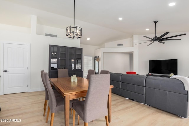 13918 N 78th Ave, Peoria, AZ 85381 - dining space with lofted ceiling, light wood-type flooring, a ceiling fan, recessed lighting, and a chandelier