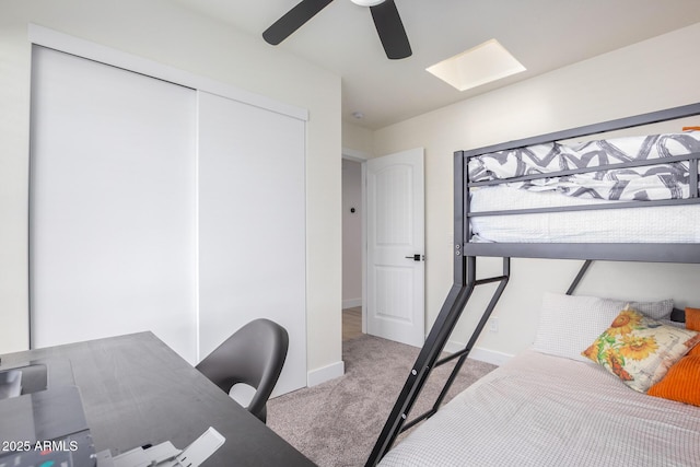 13918 N 78th Ave, Peoria, AZ 85381 - carpeted bedroom with a skylight, baseboards, a closet, and ceiling fan
