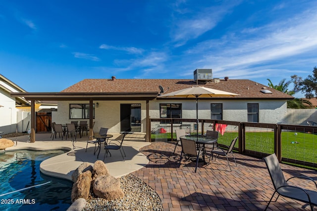 13918 N 78th Ave, Peoria, AZ 85381 - back of house featuring stucco siding, outdoor dining space, central AC unit, and a patio area