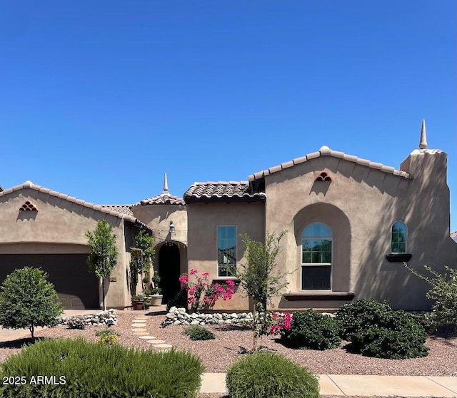 20502 W Ridge Rd, Buckeye, AZ 85396 - mediterranean / spanish house with stucco siding, a tiled roof, and a garage
