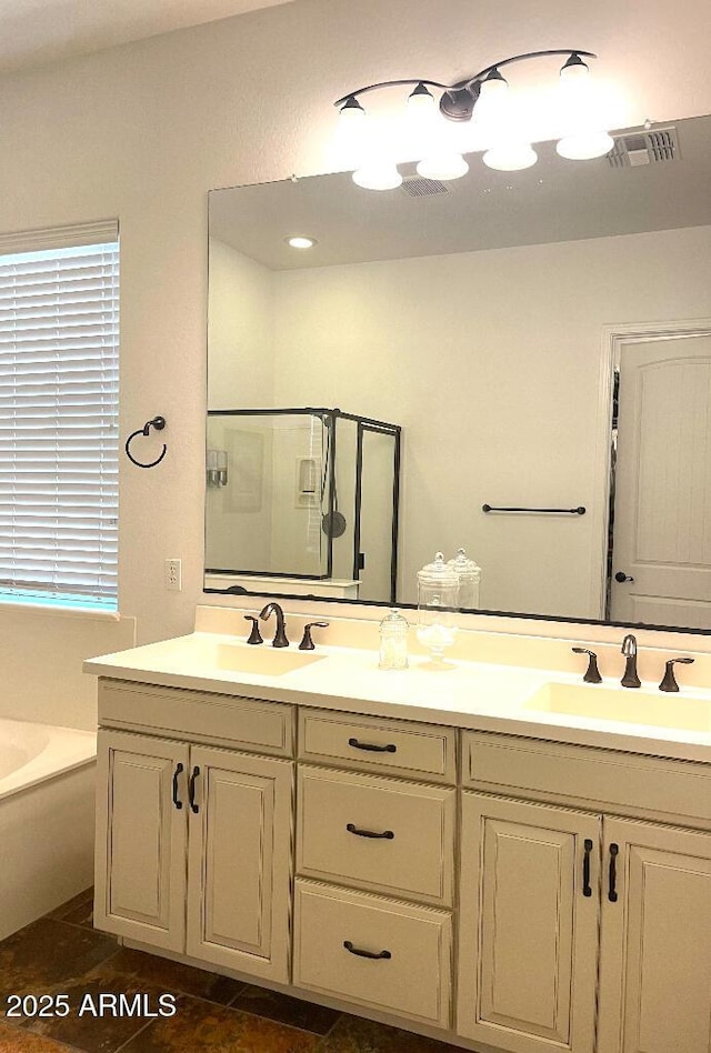 20502 W Ridge Rd, Buckeye, AZ 85396 - full bathroom with double vanity, a shower stall, a bath, and tile patterned flooring