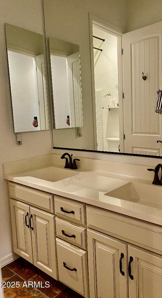 20502 W Ridge Rd, Buckeye, AZ 85396 - bathroom featuring double vanity