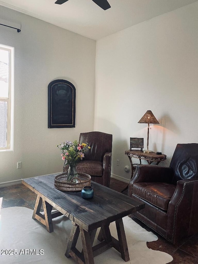 20502 W Ridge Rd, Buckeye, AZ 85396 - living room featuring baseboards and ceiling fan