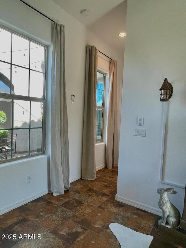 20502 W Ridge Rd, Buckeye, AZ 85396 - spare room featuring stone finish flooring and a smoke detector