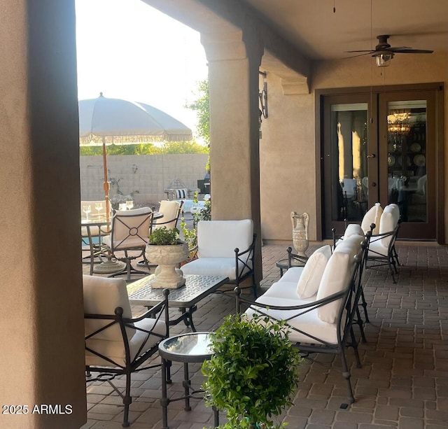 20502 W Ridge Rd, Buckeye, AZ 85396 - view of patio / terrace with french doors, ceiling fan, and a mountain view