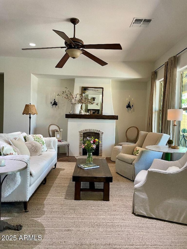20502 W Ridge Rd, Buckeye, AZ 85396 - living area featuring a ceiling fan and a brick fireplace
