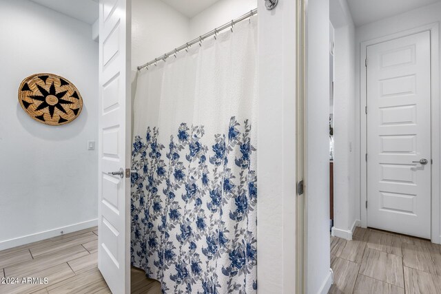 bathroom with a shower with shower curtain