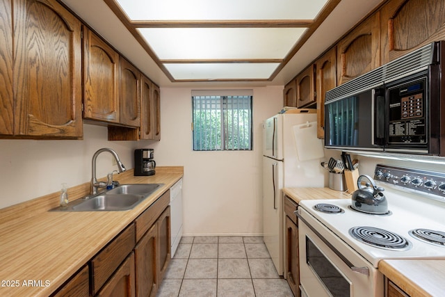 3131 W Cochise Dr Unit 144, Phoenix, AZ 85051 - kitchen featuring white appliances, a sink, light countertops, and brown cabinets