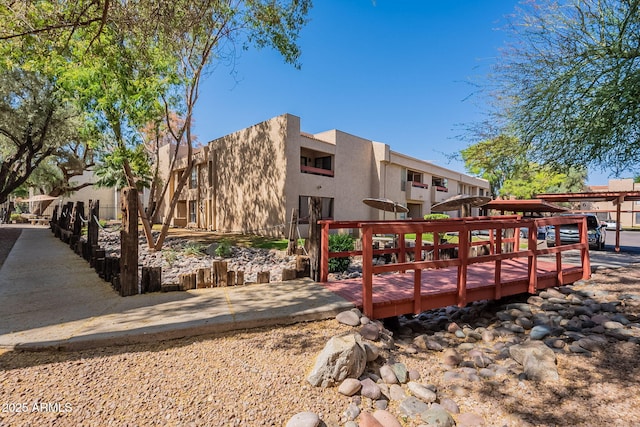 3131 W Cochise Dr Unit 144, Phoenix, AZ 85051 - back of property with stucco siding and a deck
