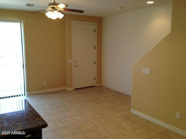 unfurnished room with ceiling fan