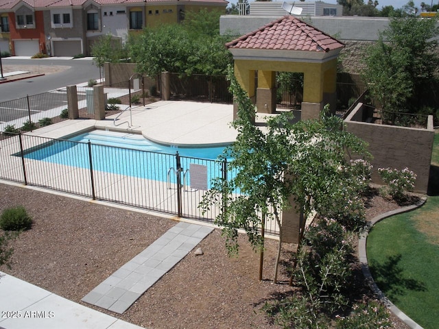 view of swimming pool with a patio